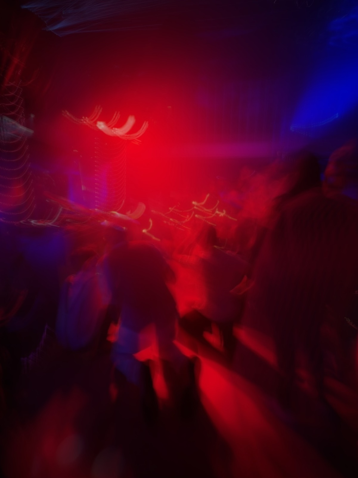 Blurred red and blue lights inside the rave