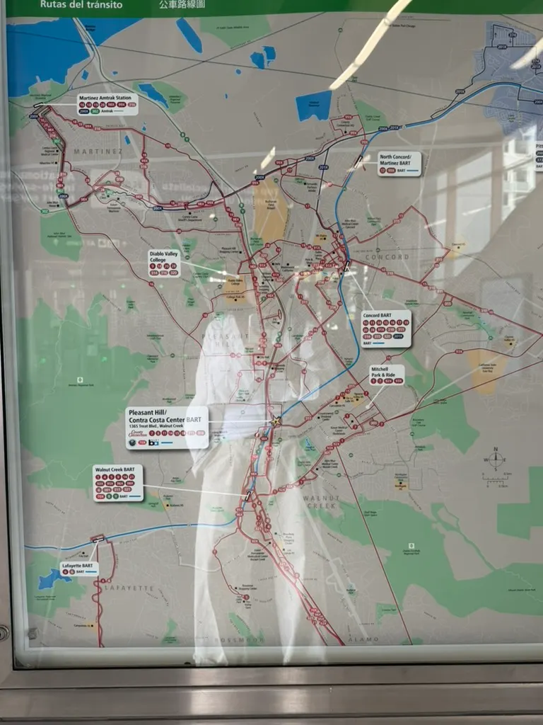 A public transit map reflected in glass